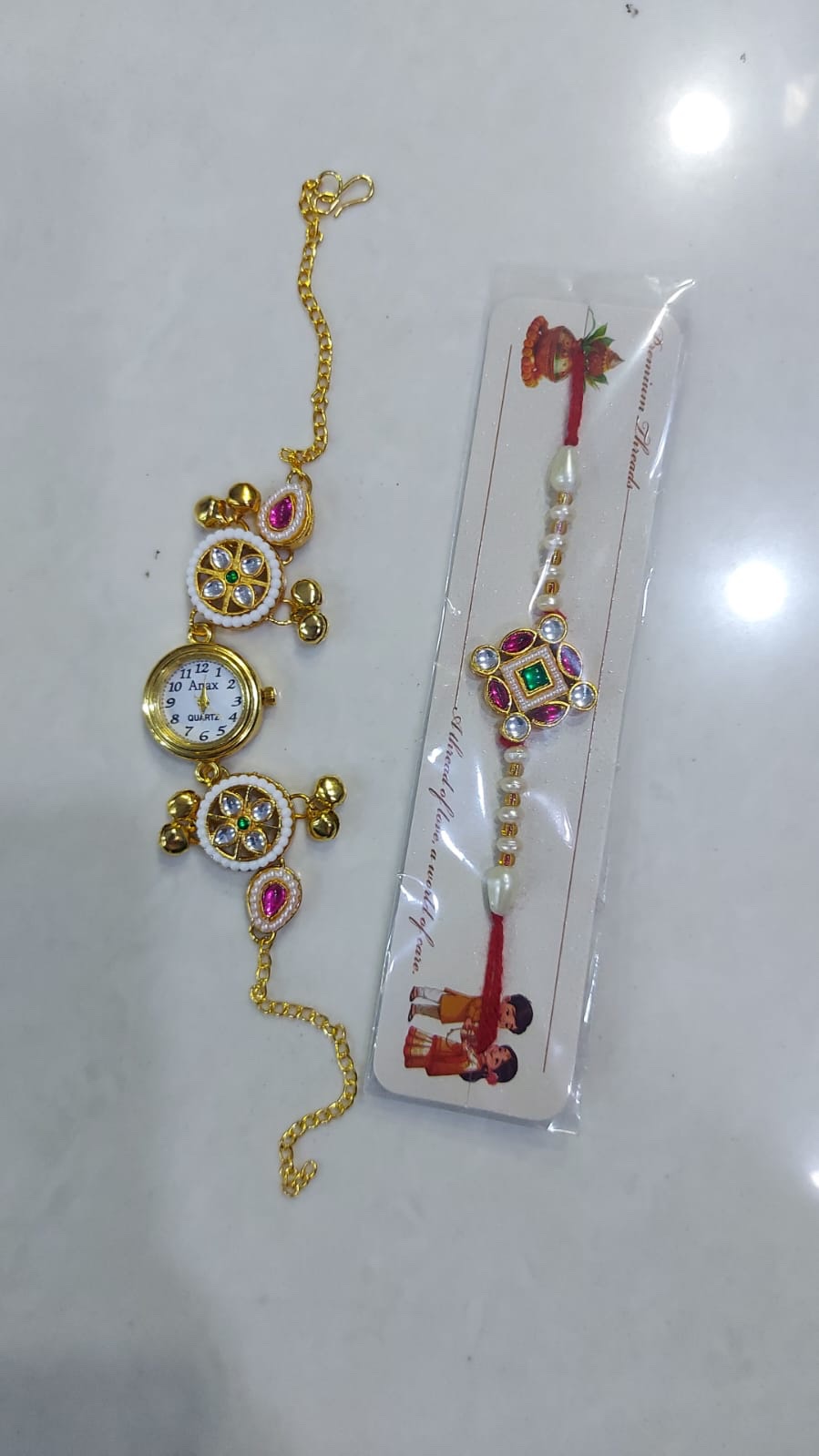 a261b902-da6c-4f16-8b92-6e450e1bf2bf Mini watch rakhi combo - Image 1