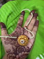 Gold borla with powai